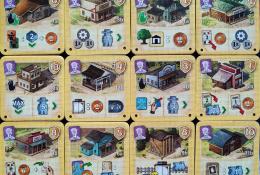 Great Western Trail - ukázka oboustranných destiček budov hráče